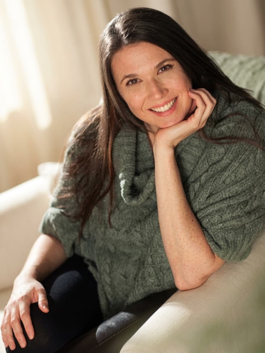 Ann Sullivan, Registered Therapeutic Counsellor, in a sage green sweater